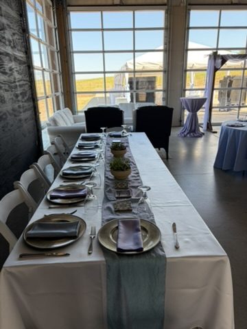 Head table set in front of the glass garage doors